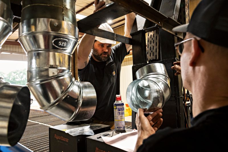 Proplate technicians inspecting components